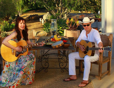 Joe & Danielle sitting with guitars, 2014